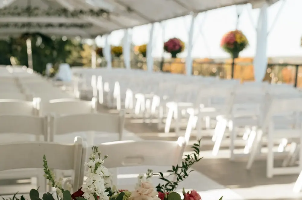 Ornately decorated tent with flowers on a beautiful day overlooking the Kirkbrae Golf Course