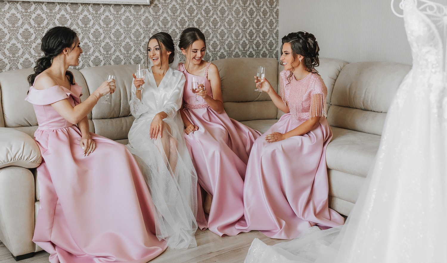 Stunningly gorgeous bridesmaids having a glass of champagne in the bridal suite at Kirkbrae country club in Rhode Island